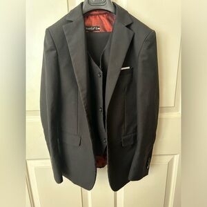Formal suit with shirt bow tie vest and jacket and pants. Adjustable waist.